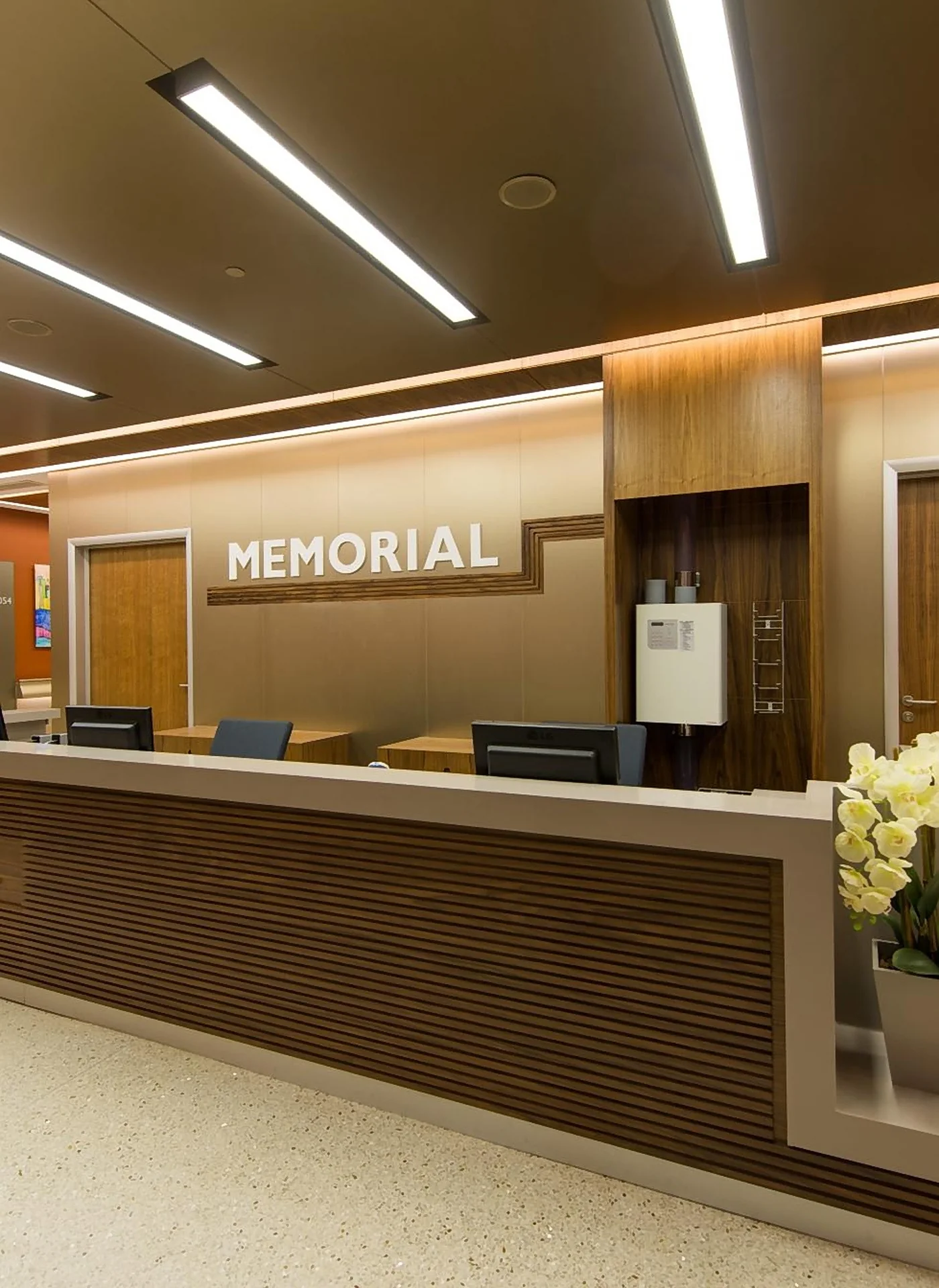A Memorial reception desk for international patients, with warm wood panelling