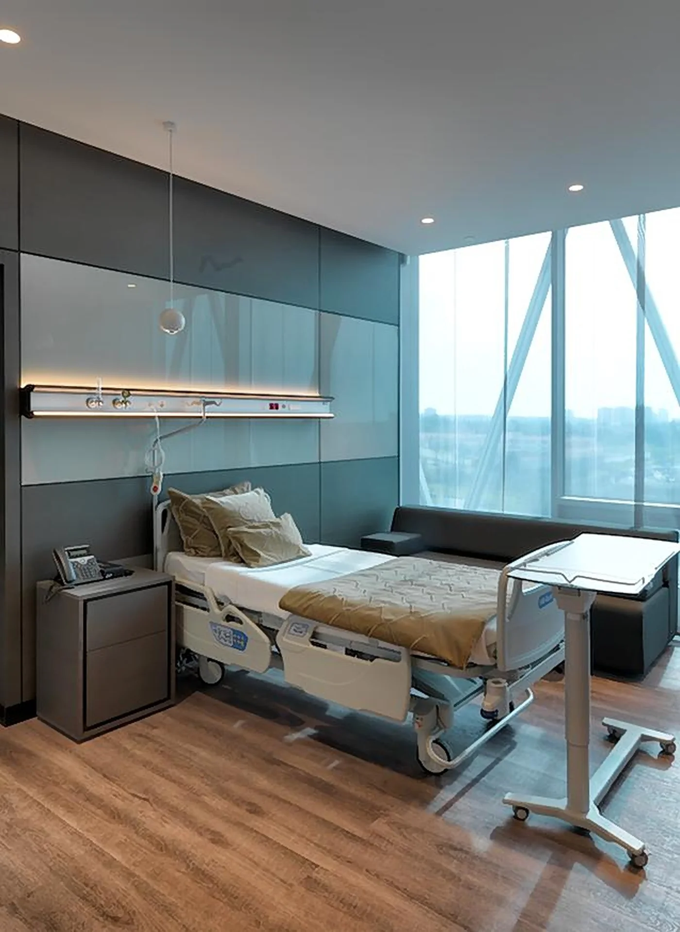A private patient room at Memorial with a large window and a sofa for a companion